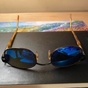 Authentic Revo sunglasses made of carbon steel with silver and gold accents.